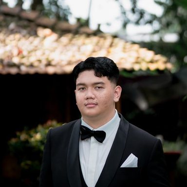 Rama Raihan in a black tuxedo and bow tie